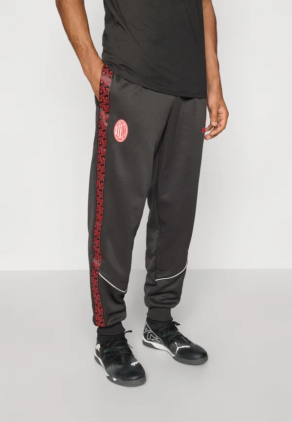ACM KING ANTHEM  - Tracksuit bottoms - black red