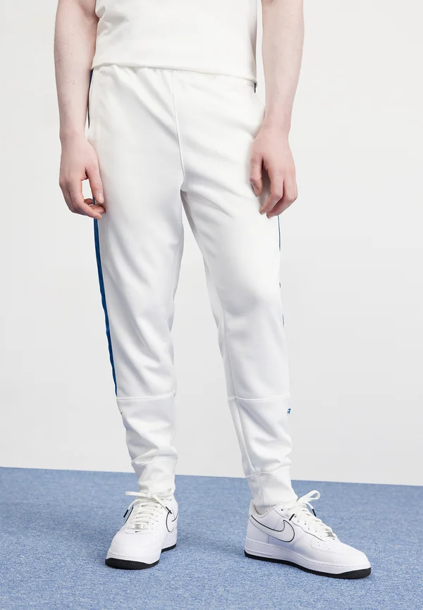 AIR JOGGER  - Tracksuit bottoms - white/court blue