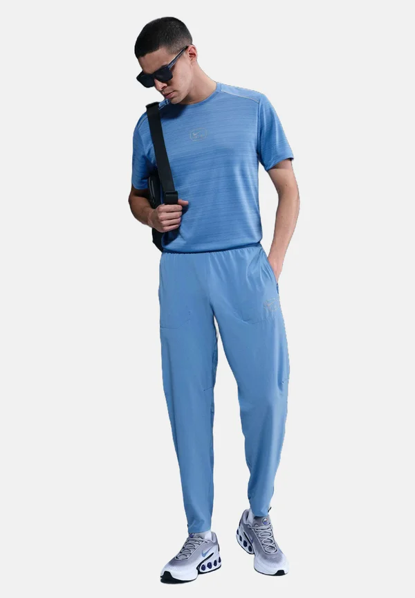 AIR - Tracksuit bottoms - blue beyond