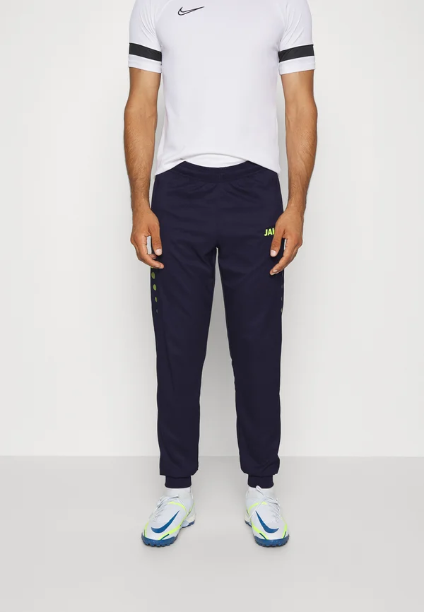 ALLROUND - Tracksuit bottoms - marine/neongelb