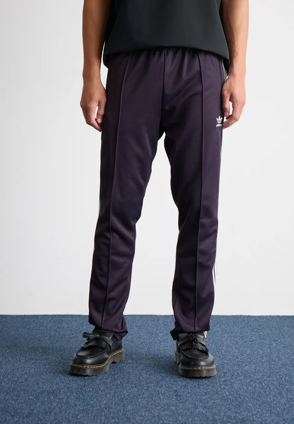 BECKENBAUER - Tracksuit bottoms - aurora black
