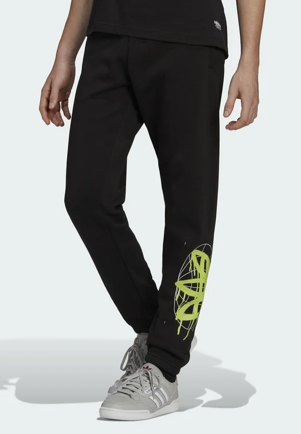 BEHIND - Tracksuit bottoms - black