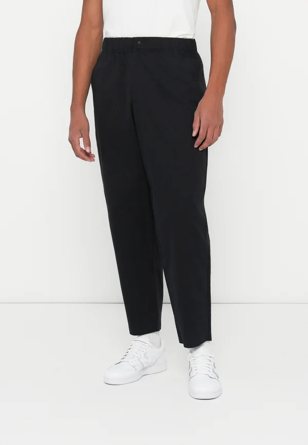 CAGOLA - Trousers - black
