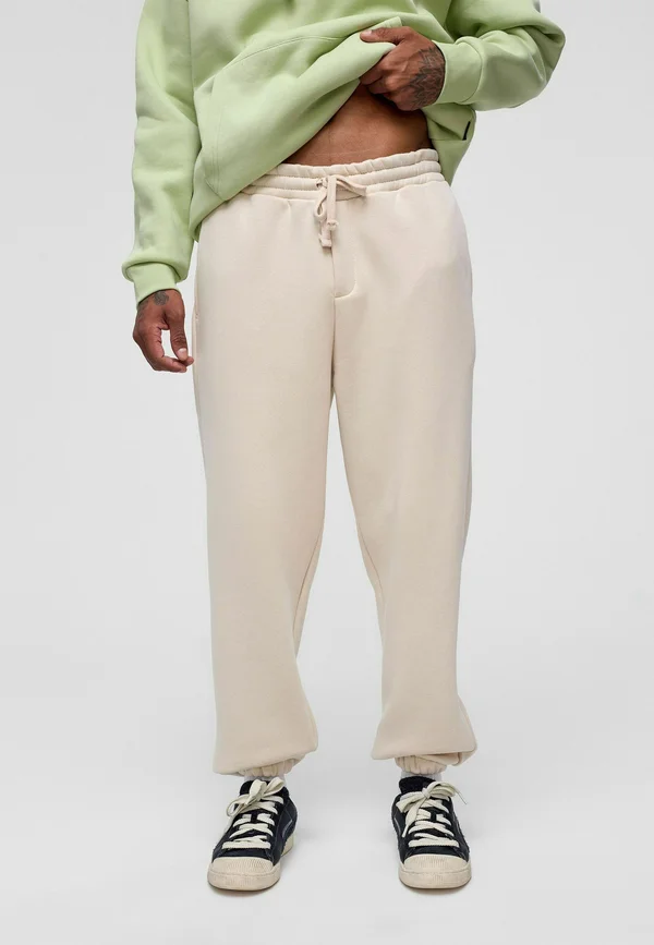 CLAUS - Tracksuit bottoms - bone
