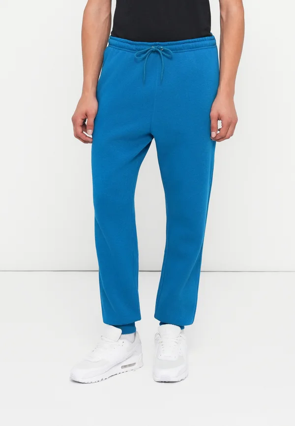 CLUB JOGGER - Tracksuit bottoms - green abyss/white