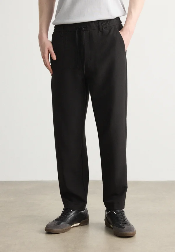CONVERT - Trousers - black