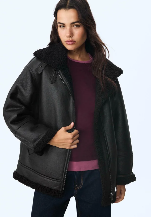 DOUBLE-FACED WITH BUCKLES - Faux leather jacket - black