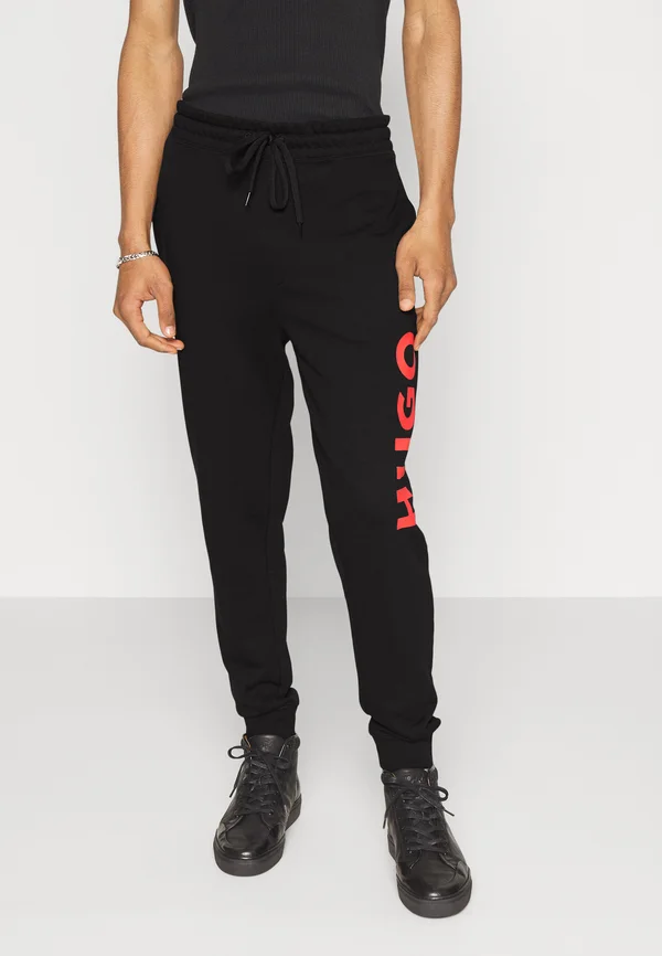 DUTSCHI - Tracksuit bottoms - black