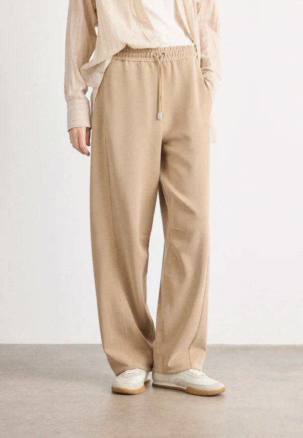 ELIJAH - Tracksuit bottoms - rust copper