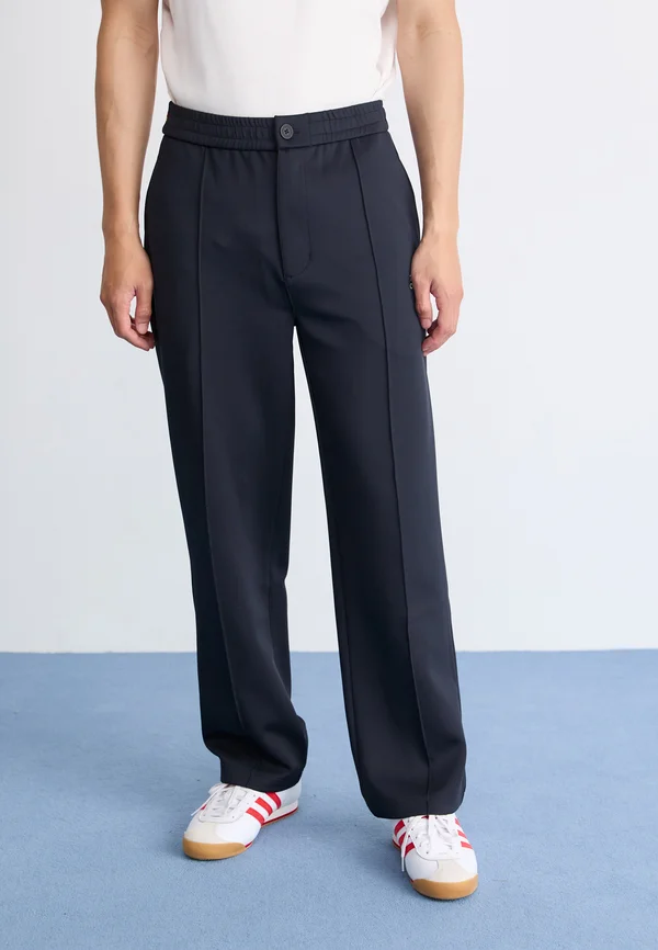 EMBLEM - Tracksuit bottoms - navy/pan africa