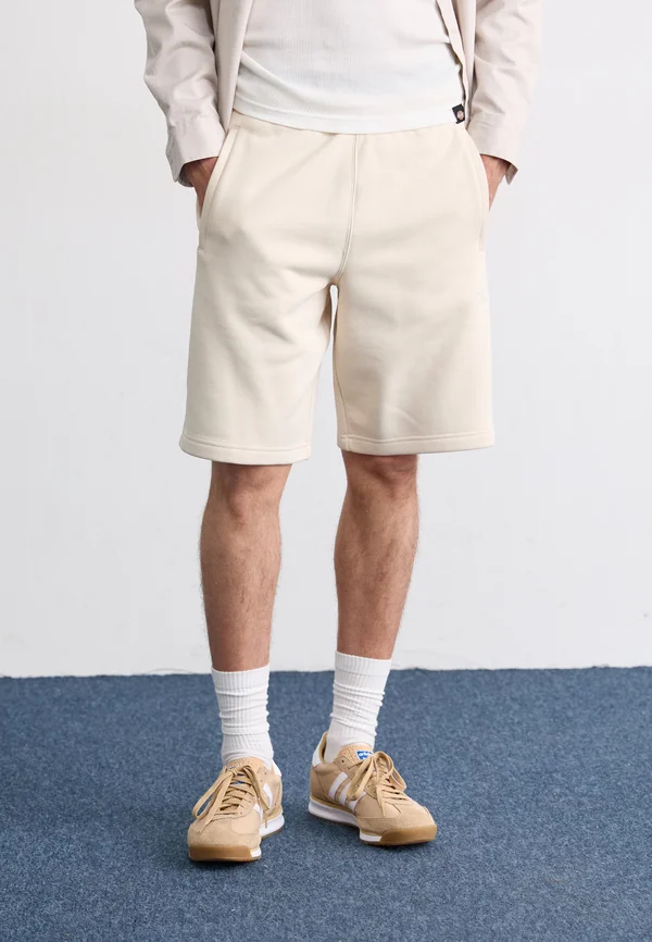 ESSENTIAL - Tracksuit bottoms - white