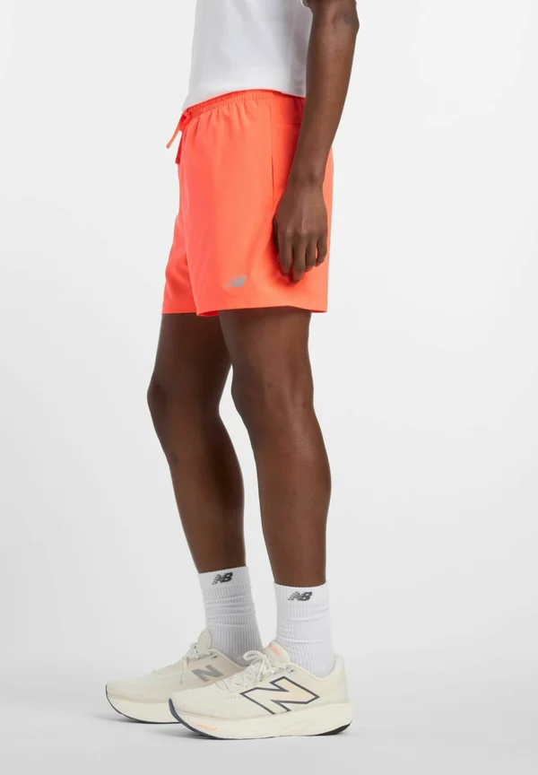 ESSENTIALS - Sports shorts - urgent red