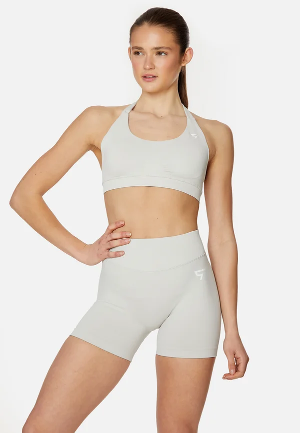 EVE SEAMLESS HALTER  - Medium support sports bra - beige
