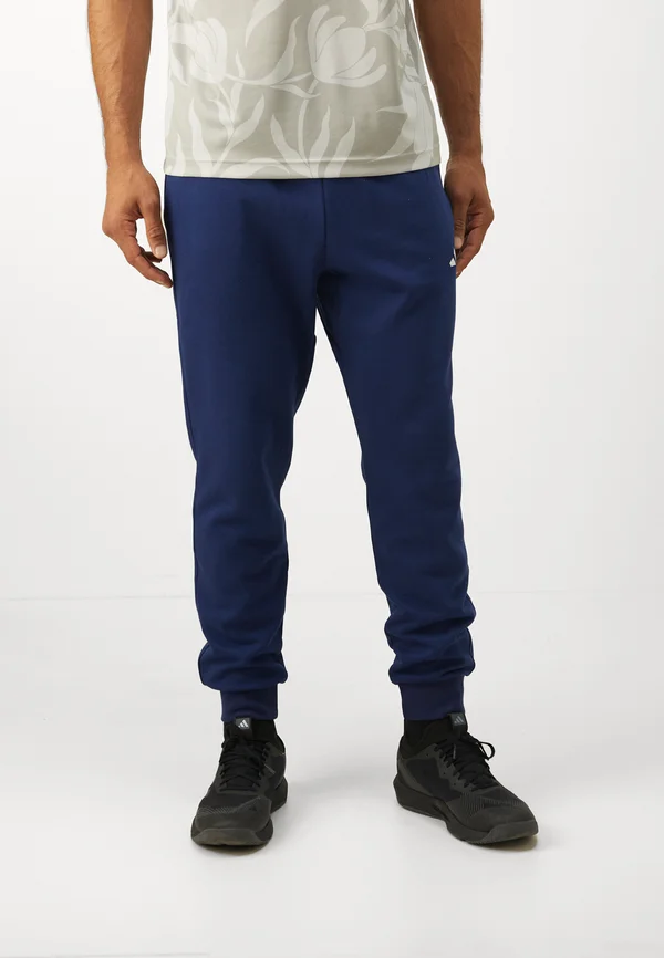 FEELCOZY - Tracksuit bottoms - dark blue/white