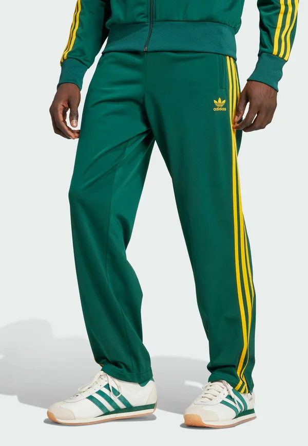 FIREBIRD  - Tracksuit bottoms - collegiate green   crew yellow