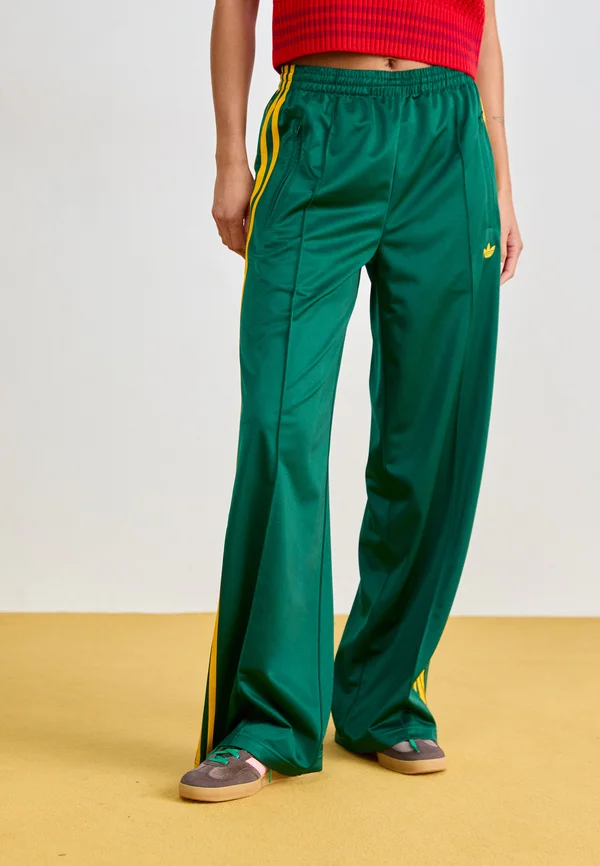 FIREBIRD - Tracksuit bottoms - collegiate green/crew yellow