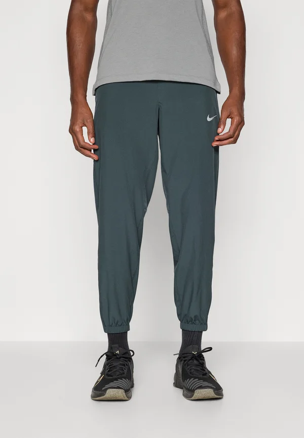 FORM PANT - Tracksuit bottoms - seaweed/black/reflective silver-coloured