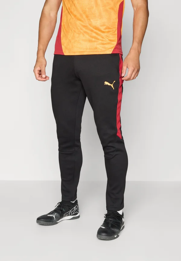 GSK EVOSTRIPE - Tracksuit bottoms - black/red rhythm/intense orange