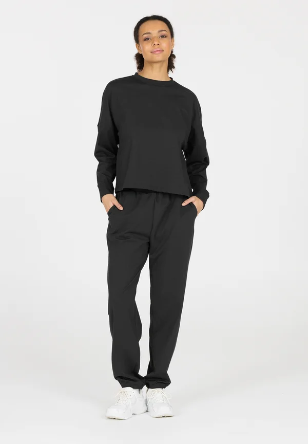 GUYANA - Tracksuit bottoms - black
