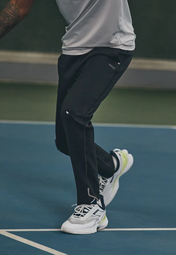 HICON ACTIVE - Tracksuit bottoms - black