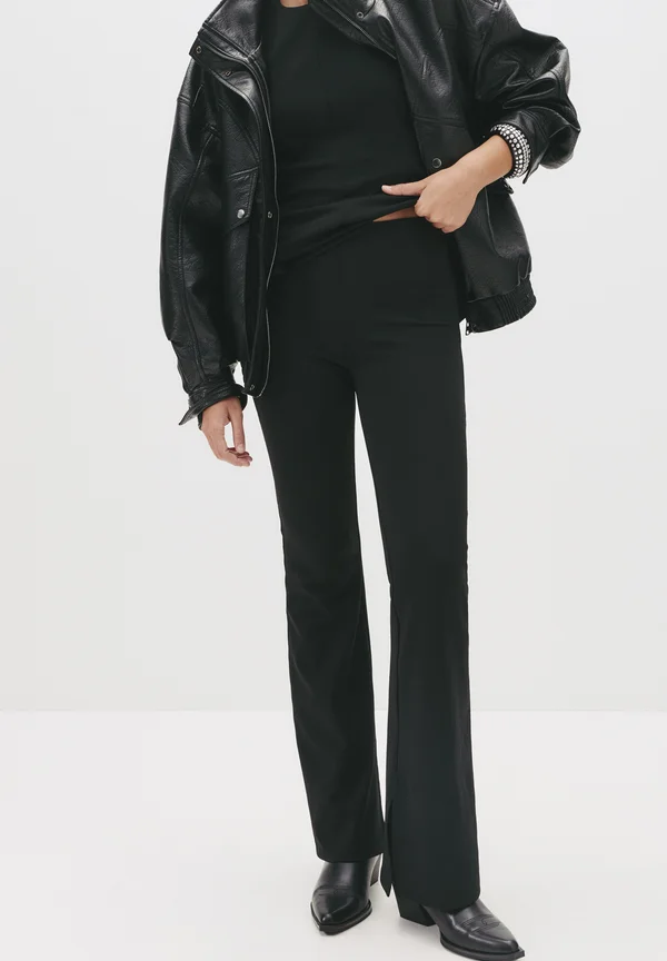 HIGH-WAIST FLARED - Trousers - black