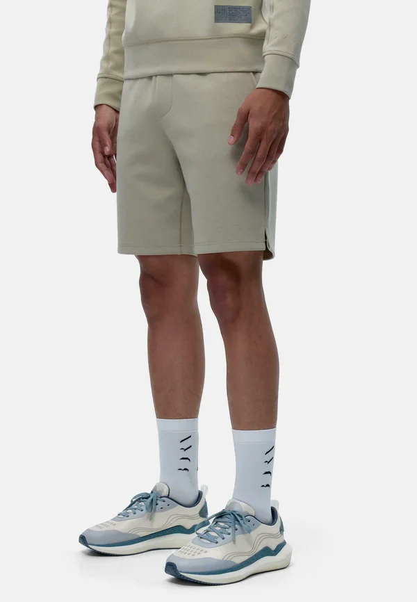 HUGHES - Tracksuit bottoms - beige