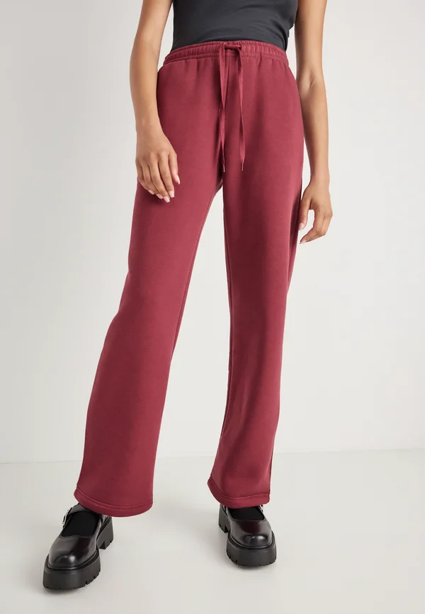 ICONIC - Tracksuit bottoms - tawny port