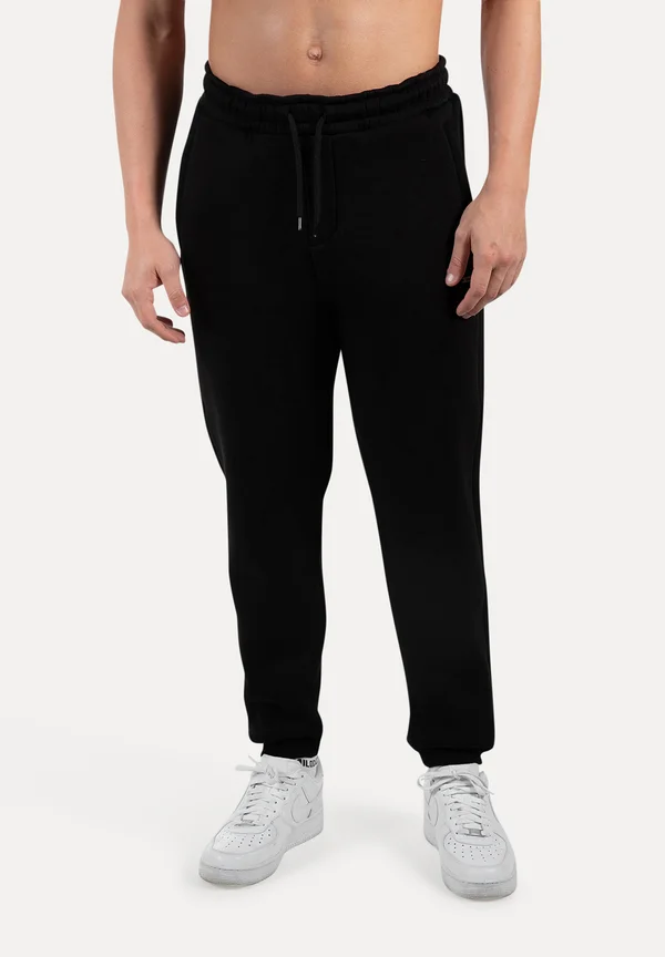 ILYAS - Tracksuit bottoms - schwarz