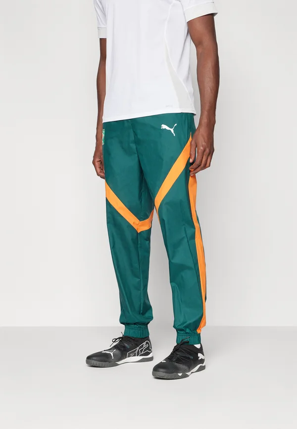 IVORY COAST FIF PREMATCH WOVEN PANT - National team wear - dark myrtle/rickie orange