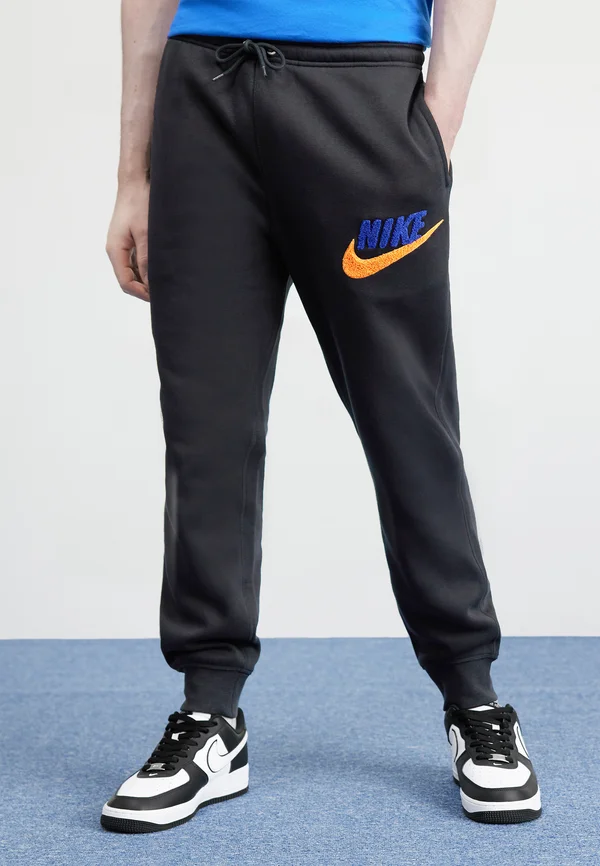 JOGGER - Tracksuit bottoms - black/deep royal blue/safety orange