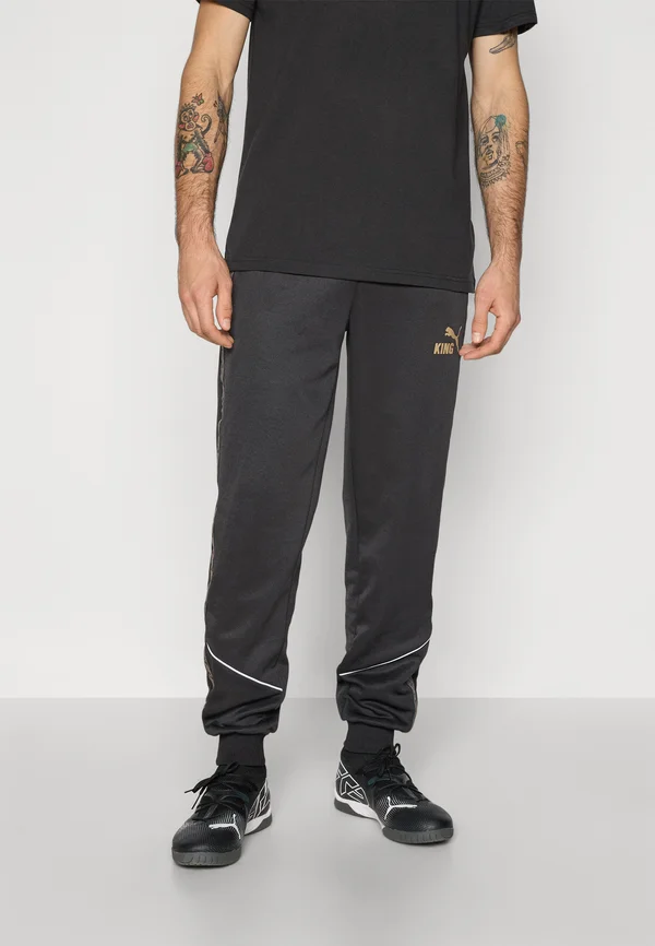 KING ANTHEM PANTS - Tracksuit bottoms - black/matte gold-coloured/white