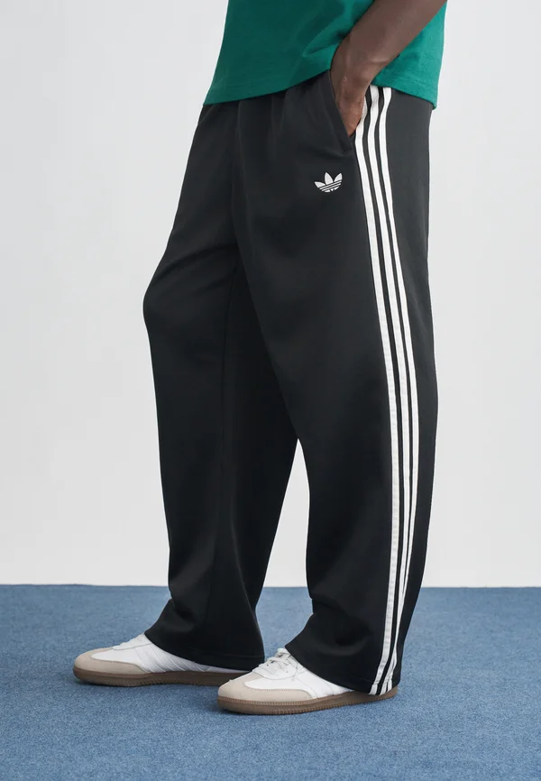 LOOSE TP - Tracksuit bottoms - black/white