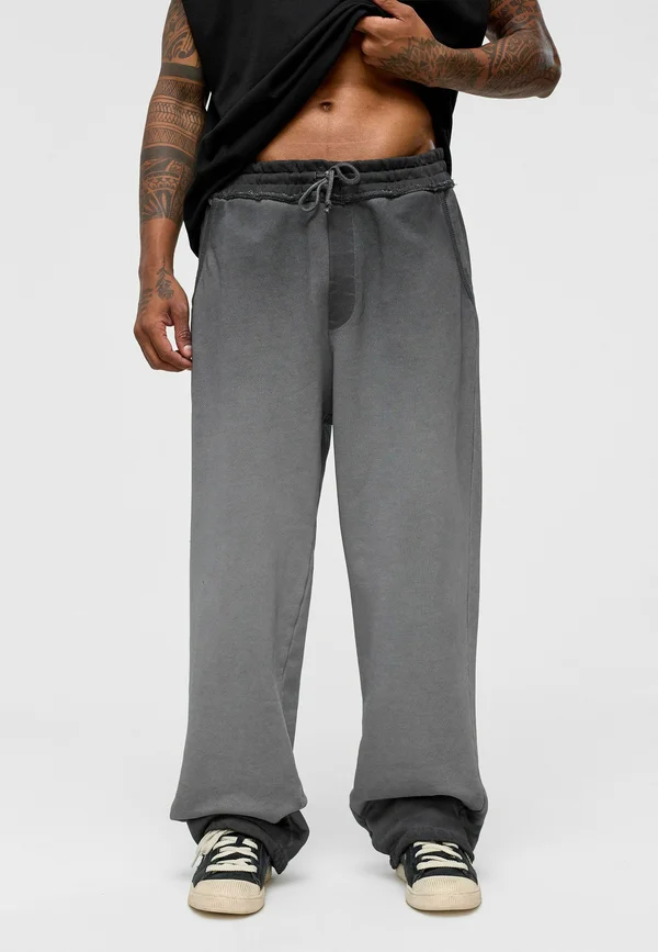 MARK - Tracksuit bottoms - black