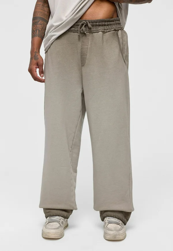 MARK - Tracksuit bottoms - mink