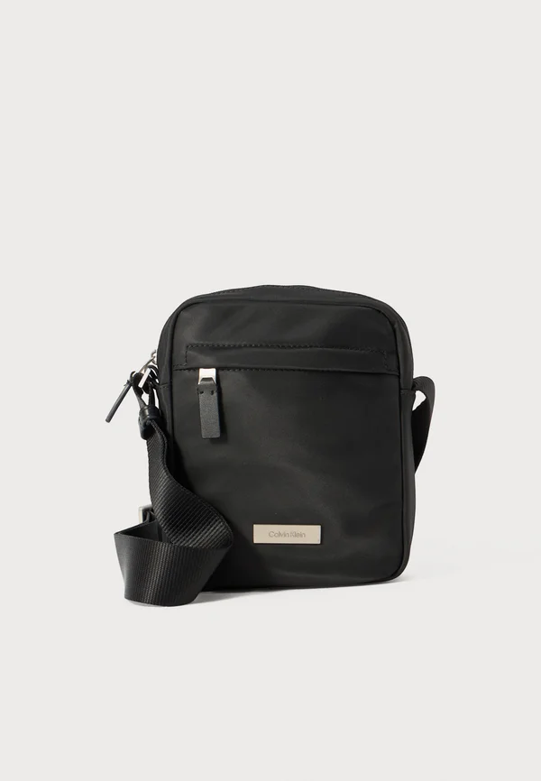 MICRO PEBBLE - Cross body bag - black