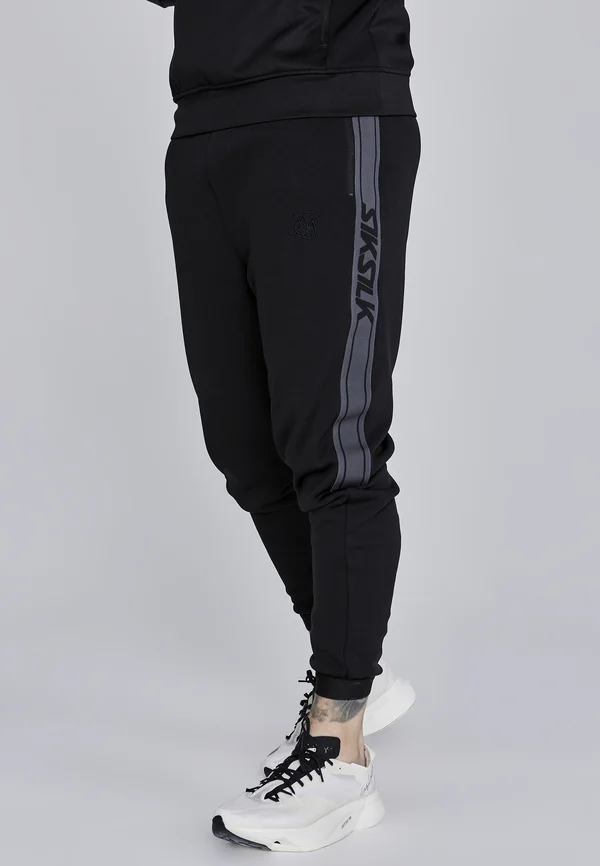 MUSCLE FIT  - Tracksuit bottoms - black