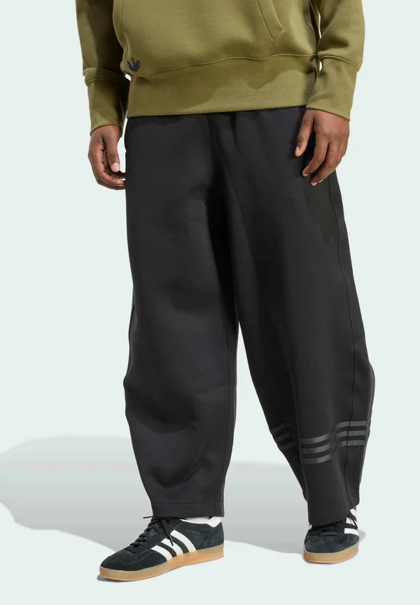 NEUCLASSICS - Tracksuit bottoms - black