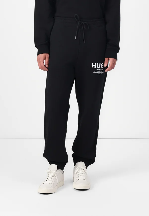 NEVEZ - Tracksuit bottoms - black