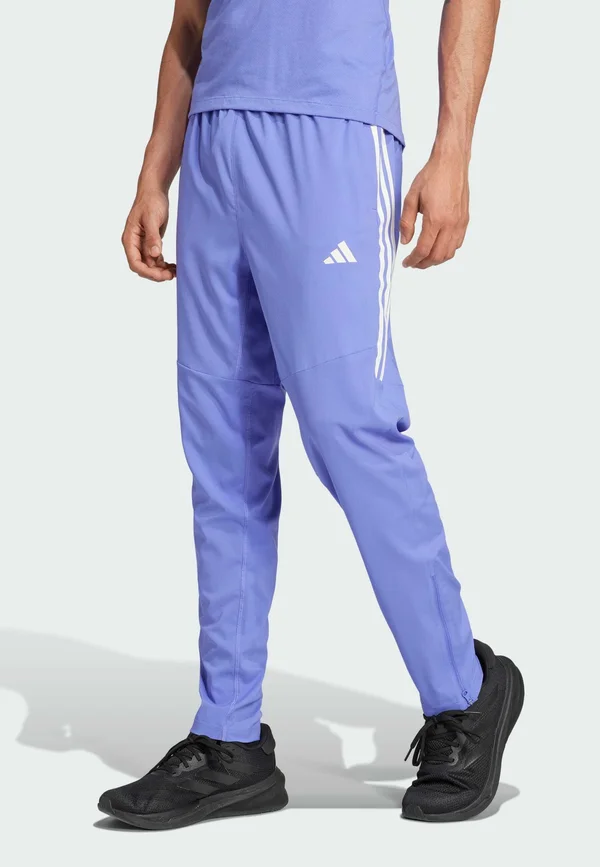 OWN THE RUN 3-STRIPES - Tracksuit bottoms - semi blue
