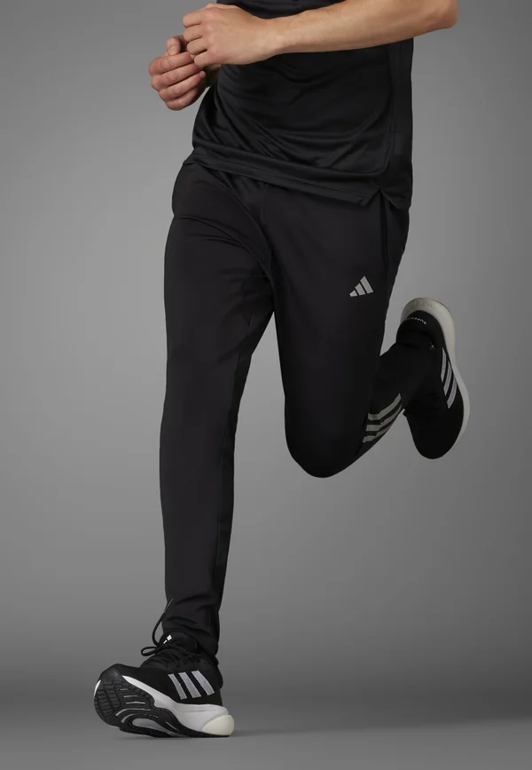 OWN THE RUN ASTRO SEAMLESS KNIT - Tracksuit bottoms - black