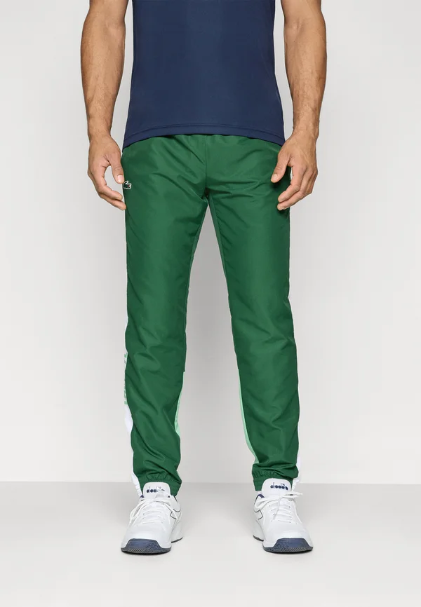 PANT LCST FC - Tracksuit bottoms - green/white liamone