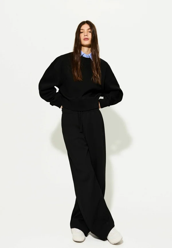 PLUSH BARREL - Tracksuit bottoms - black
