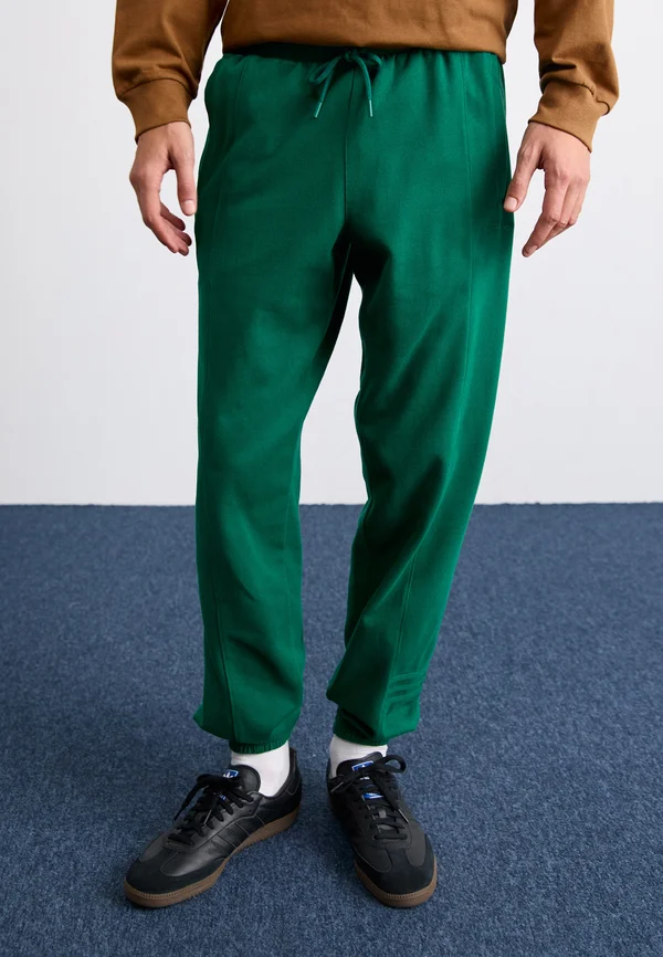 PRE-LOVED - Tracksuit bottoms - collegiate green