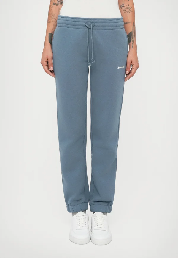 REGULAR - Tracksuit bottoms - blue