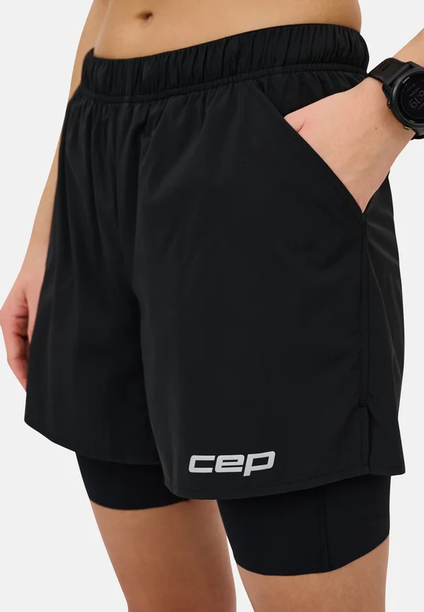 RUN 2 IN 1 - Sports shorts - black