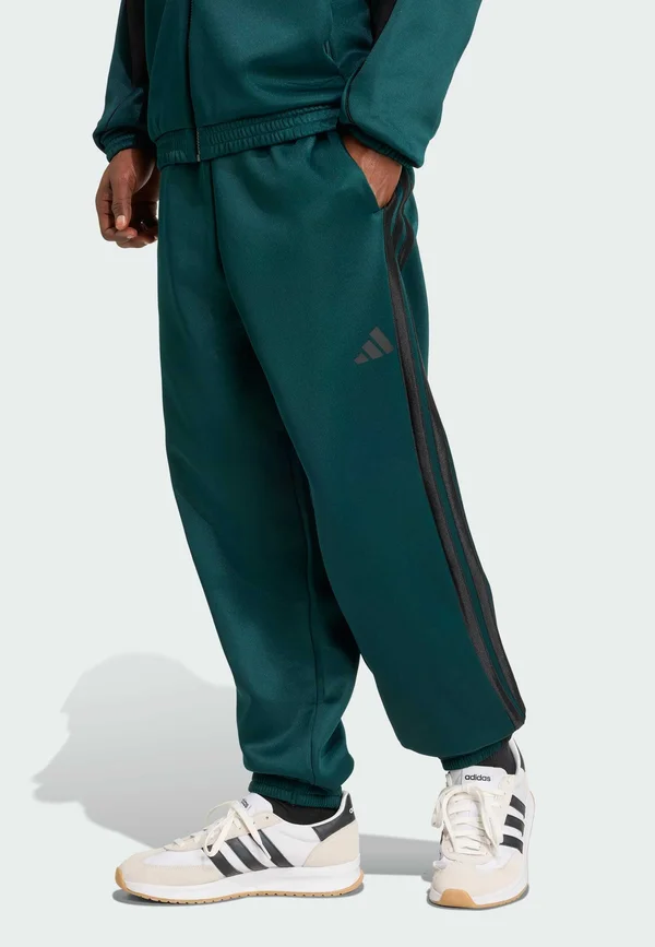 STADIUM - Tracksuit bottoms - aurora ivy   black