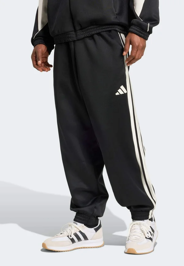 STADIUM - Tracksuit bottoms - black/off-white
