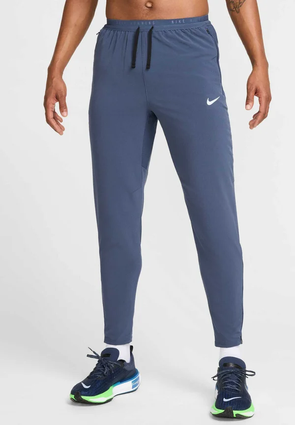 STRIDE - Tracksuit bottoms - thunder blue