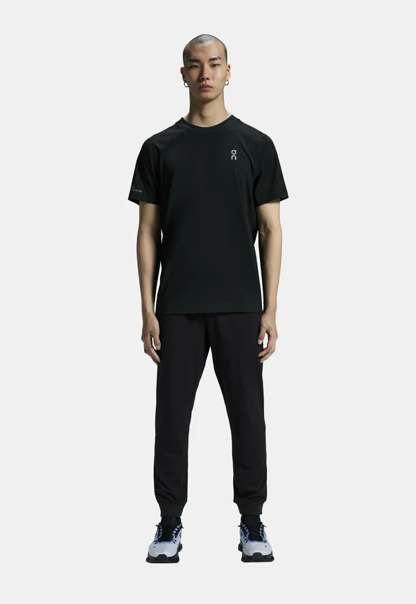 STUDIO JOGGERS - Tracksuit bottoms - black