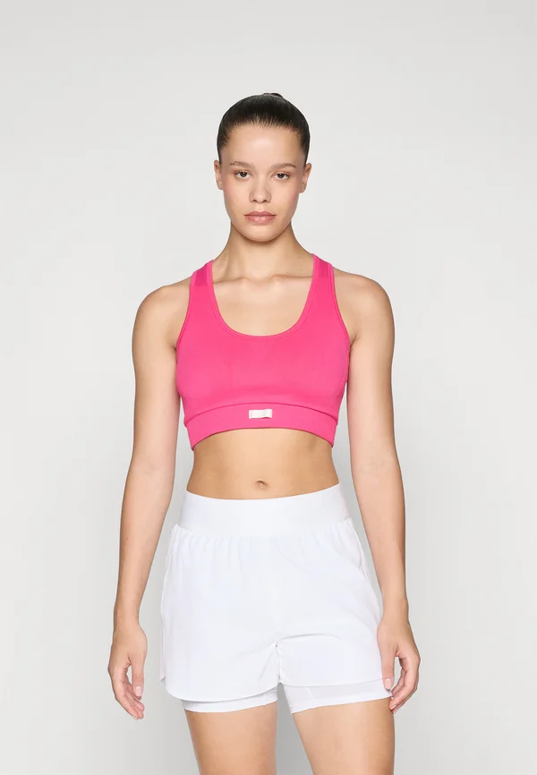 STUDIO SEAMLESS LOW BRA - Light support sports bra - pink glow
